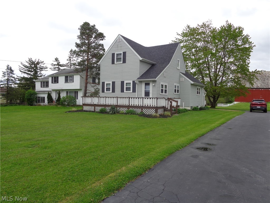 Wow!! You won't want to miss out on this Century home with its character, charm and modern updates. All major systems are updated. The roof is 1 month old with a 30 year warranty on the shingles.  Glass block windows installed in 2025. Furnace in 2015  A/C August of 2024. newer siding, tilt in windows and complete insulation throughout, The driveway and garage built in 2018. Updated electrical. Laminate flooring and new carpet. Freshly painted from top to bottom. 1st floor has a primary bedroom, laundry, big kitchen with pantry, foyer and large dining and living room. The second floor has 3 bedrooms and a large bathroom with a huge hallway closet. All bedrooms have ceiling fans and new blinds. The walkout basement is painted and has a newly tiled large shower. and plenty of storage. The barn has electricity, fenced in paddock out the back door and 6 horse stalls. The use of this barn is only limited by the imagination, Whether it's for hobbies, personal use or income producing. The private pond, surrounded by nature,  is the perfect place to sneak away to and enjoy a little peace and serenity, or do a little fishing.  Whether you want to walk the property, ride a horse along a trail to Valley Pkwy, ride ATV’s , or ride on a golf cart, this property offers something for everyone in your family. This home offers the serene, private, rural feel with the modern day convenience’s close by. North Royalton school district provides a top tier education. All this close to major highways and minutes to downtown.