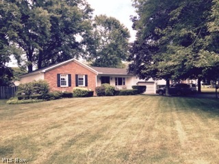 3 bedroom brick and vinyl home features living room, formal dining room, eat in kitchen, family room with fireplace, 2 1/2 baths, water proofed basement with guarantee, newer shingles and siding, central air, wooded lot.  Cement deck, fenced in yard, 2 car attached garage and more.  Back deck 24 x 15, front porch 24 x 4, 2 sheds.  Replacement windows throughout.