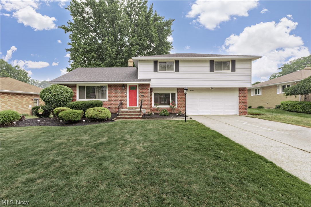 Pride of ownership is the hallmark of this meticulously maintained, 4-bedroom, 2.5-bathroom split-level home. Designed to effortlessly accommodate all your family's needs, the thoughtful interior layout transitions beautifully from daily living to weekend entertaining. The main level welcomes you with a spacious living room that flows seamlessly into the dining area, where sliding glass doors offer a smooth transition to the outdoor space. At the heart of the home is a fabulous, fully renovated eat-in kitchen, beautifully appointed with quartz countertops, stainless steel appliances, a dedicated pantry, and ample cabinet and counter space. Just a few steps down, the sunken family room provides a wonderful retreat for relaxation, complemented by a convenient first-floor powder room. The second floor features four generously sized bedrooms with excellent closet space. The primary bedroom opens to a beautifully remodeled en-suite bathroom, while the main hallway offers easy access to additional integrated storage. For even more functional space, the partially finished lower level delivers a recreation room perfect for relaxing or entertaining, alongside a dedicated laundry area and plenty of additional storage space. Home warranty. Outdoors, the rear patio overlooks a lovely, flat backyard perfect for seasonal gatherings. Best of all, this spectacular opportunity places you just minutes away from premier shopping, local restaurants, and essential daily amenities