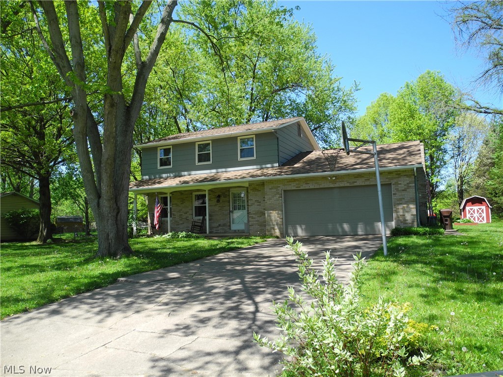 First floor dine-in kitchen, dining room, living room, family room and half bath. Second floor has 3 bedrooms and full bath.  Basement has finished room with closet, built in shelves and a bar.  Unfinished laundry room and large cement floored crawl space for storage under lst floor family room.
Covered front porch on wooded lot with a large back deck off the family room. Large flat lot with 10 x 12 storage barn.  Home is located at the end of the street with light woods at the end.
2 car attached garage, central air, gas forced air furnace.  Comes with refrigerator, electric stove, washer , dryer, water softener, dishwasher, garbage disposal.  Newly installed roof on the home and barn in March, 2019. Aeration Septic System to be installed before sale of the home at sellers cost. Vinyl flooring just installed in kitchen as well as new carpet installed on the steps to basement and thru out the lower level rec room April 2019  Possession at closing.