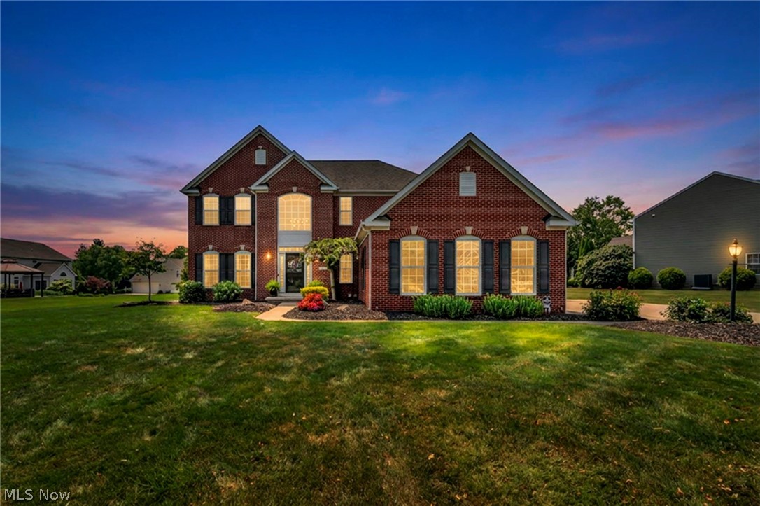 Tucked away on a quiet street with virtually no through traffic, this beautifully updated Richfield home offers the perfect blend of privacy, comfort, and resort-style living. Situated on a half-acre lot with expansive HOA greenspace behind, you'll enjoy a peaceful setting just minutes from Hinckley Reservation, the Metro Parks, golf, skiing, dining, and major highways. Inside, a soaring two-story foyer, 9-foot ceilings, and an open floor plan create an inviting space perfect for everyday living and entertaining. The updated kitchen features maple cabinetry, granite countertops, stainless steel appliances, and an oversized center island, flowing seamlessly into the bright sunroom overlooking the backyard. Step outside and discover what truly sets this home apart. A stunning timber-frame covered pavilion with vaulted ceilings, skylights, a gas fireplace, composite decking, and retractable shade overlooks the heated 18' x 36' inground pool, stamped concrete patio, waterfall feature, and built-in fire pit—creating an outdoor living space you'll never want to leave. Upstairs, the spacious owner's suite features a beautifully renovated en-suite bath with dual vanities, a luxurious glass walk-in shower, and soaking tub. Three additional bedrooms, a finished lower level offering endless flexibility, an all-brick exterior, and a three-car side-load garage complete this exceptional home. This is more than just a beautiful house—it's a place you'll love coming home to.