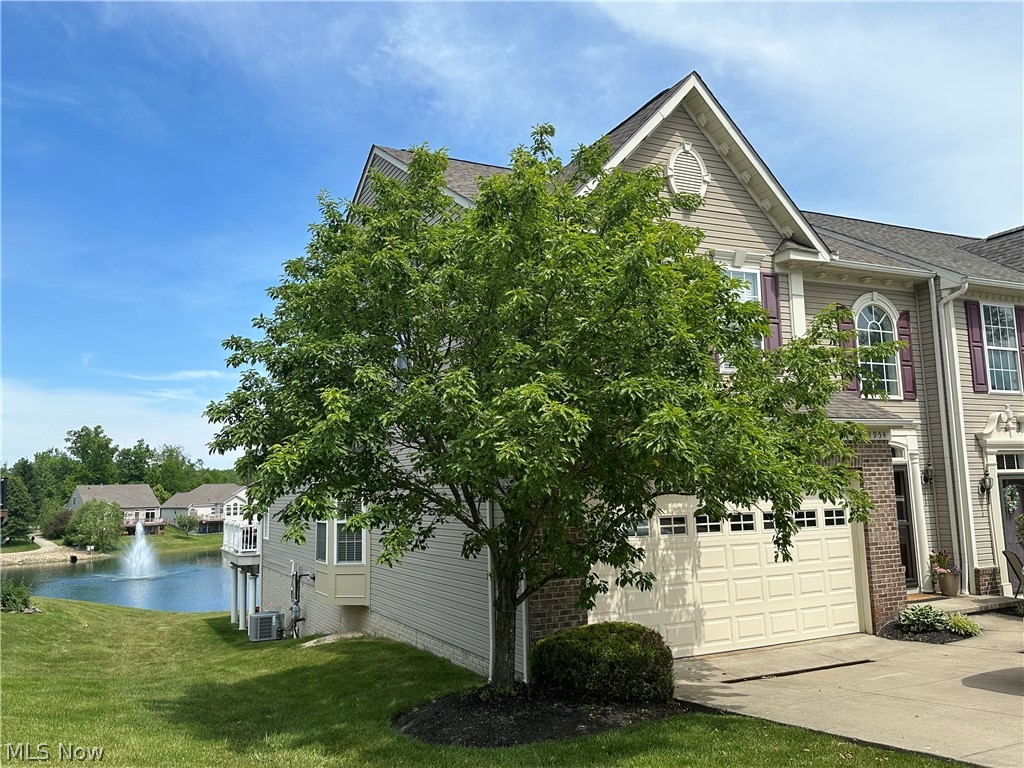 This spacious Hidden Lakes townhouse is truly move-in ready and beautifully refreshed throughout, featuring fresh paint, new carpet, granite countertops, updated lighting and fans, newer French doors and garage door, remote window coverings, and smart built-in storage.

What sets this home apart are the stunning water views from every level—enjoy them from the great room and deck, the primary suite, upstairs loft, and even the walk-out lower patio.

Inside, the open floor plan showcases vaulted ceilings, warm hardwood floors, and a kitchen designed for both everyday living and effortless entertaining. The first-floor primary suite offers a tray ceiling, walk-in closet, and private bath for easy main-level living.

Upstairs, you’ll find a versatile loft, additional bedrooms, bonus room, and full bath—perfect for guests, office space, or hobbies. The finished walk-out lower level expands your living area with a rec room, full bath, and direct patio access, ideal for relaxing or hosting.

All of this is paired with low-maintenance living, as the HOA handles landscaping and snow removal, plus the rare bonus of a natural lake where you can fish right from your own backyard.

A rare combination of updates, space, views, and lifestyle—this is one you truly need to experience in person.