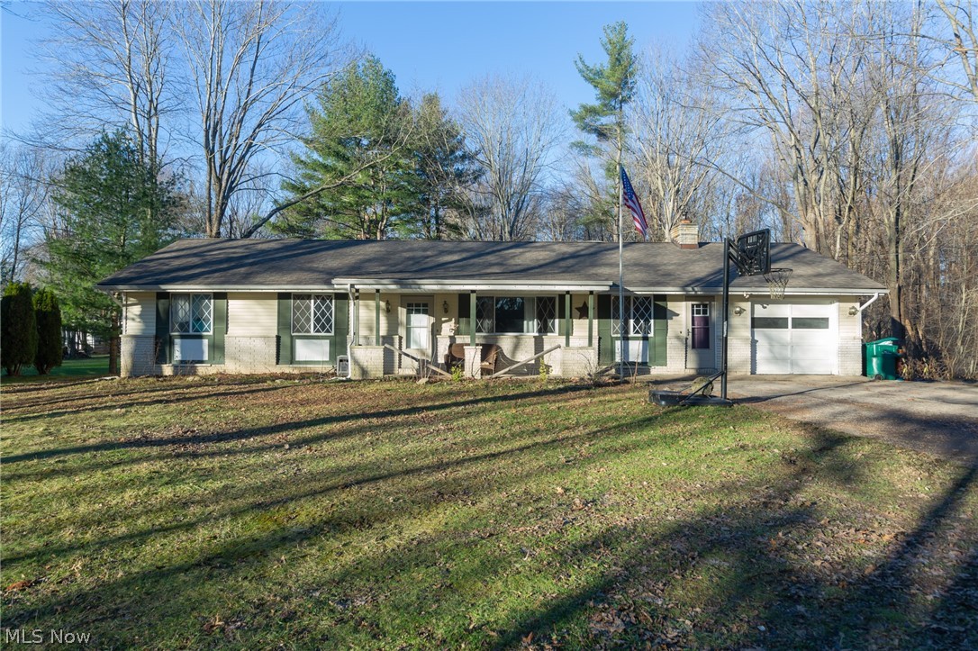 Easy one floor living on a wooded lot!  Open floor plan offers flexibility to use the space in different ways. Pellet stove located in the vaulted dining area gives an option over baseboard heat. Kitchen is updated and appliances stay.  Covered porch along the back of the home is a perfect place to enjoy the private, wooded views.  Home has room for sweat equity so you can make it your own! Located near Laurentia Winery, Hogback Ridge Park, Hidden Valley Park.  Quick drive to access Route 90.