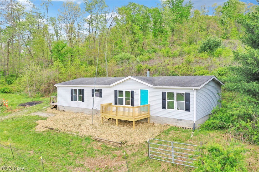 Step into country living with modern comfort in this charming 3-bedroom, 2-bath home set on just over 2 acres of scenic beauty. Inside, you’ll love the spacious open-concept layout where the kitchen flows seamlessly into the living room—perfect for entertaining or everyday living. The large kitchen offers plenty of room to cook, gather, and make memories, while the oversized primary suite features a generous master bath designed for relaxation. Fresh new carpet adds a clean, updated feel, and the inviting front porch is the perfect spot to unwind and take in the peaceful views. Outside, the property truly shines with a small barn ready for a couple of animals, hobbies, or extra storage. If you’ve been looking for space, comfort, and a touch of country charm—this one checks all the boxes.