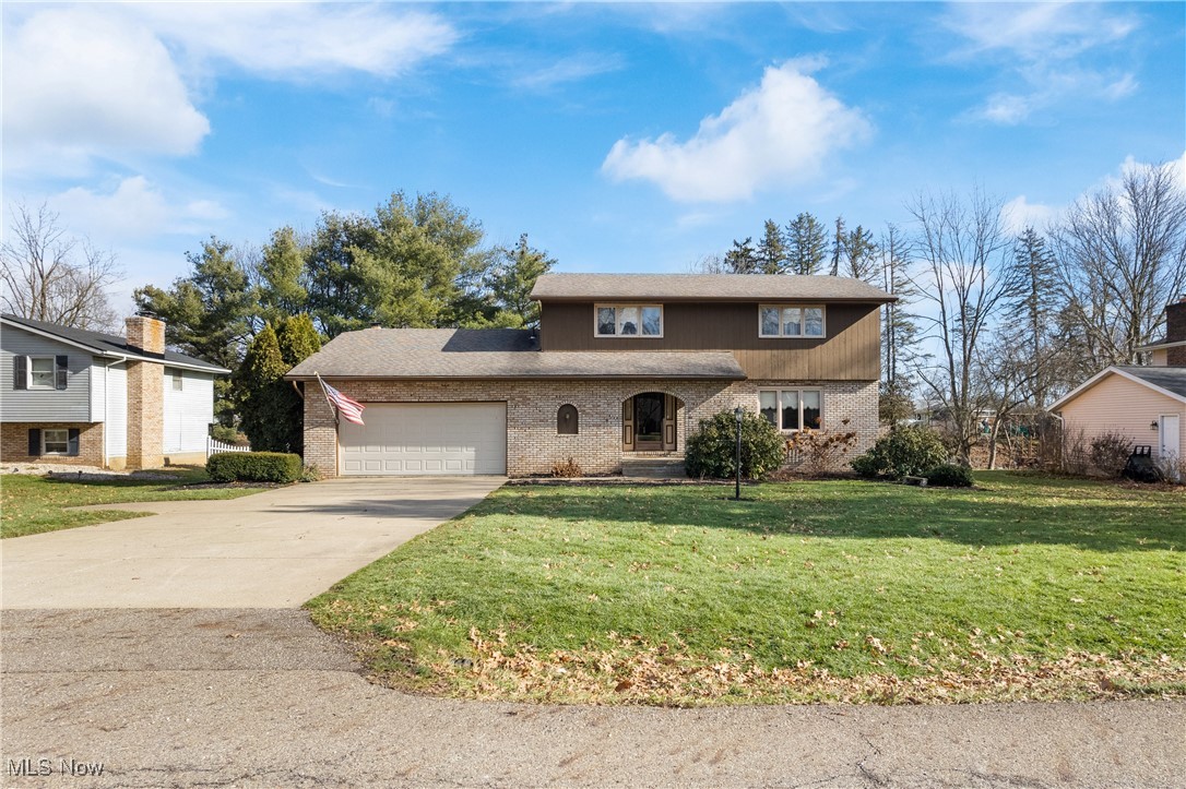 Now...Look at This!!! Remarkable 4-bedroom, 2.5-bathroom in North Canton School District. This one owner home offers over 2,100 sq ft of METICULOUSLY maintained living space. Inviting foyer with large coat closet leads you to the thoughtfully redesigned open-concept kitchen featuring unique granite countertops, a spacious island with seating and double pantries—all brought together by the rich neutral tones of newer luxury vinyl flooring (3yrs) that seamlessly transitions into the family room with gas fireplace. The first floor is complete with a formal dining room, formal living room, a convenient laundry room adjacent to the kitchen, and a remodeled half bath. Upstairs you will find four generous bedrooms. The primary suite is a true retreat, spacious enough for a king-sized bed and additional furniture, complemented by expansive closets and a private bath. Secondary bedrooms do not compromise on space. Step outside through the family room sliding glass doors to the back deck that invites relaxation amid the tranquil views and gentle whispers of a small creek. Two-car garage attached garage with bump out for extra storage and lawn equipment. 200 amp electric. Recent updates include a furnace and A/C 2022, Roof approx.10 yrs, LVT 3 yrs, 2nd floor bathrooms 3 yrs, Custom shades in primary BR, well pressure tank 4 yrs. Landscaping was professionally done 2 years ago.