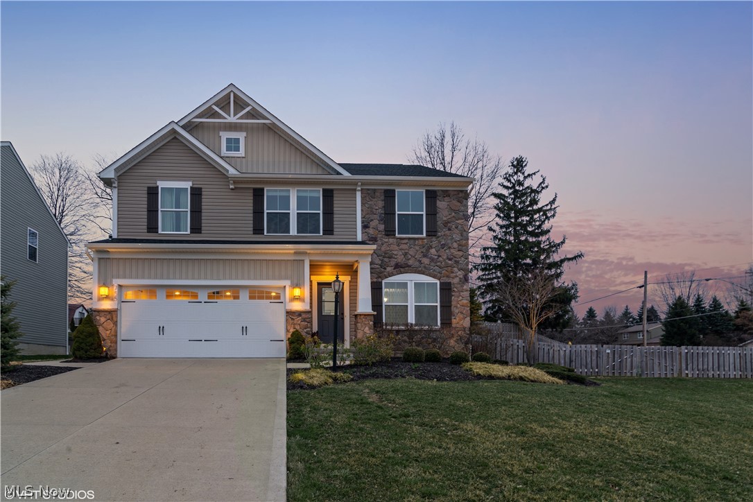 Welcome to 755 Olympic Way! This 3 bed, 3.5 bath former model home is full of updates. Step inside, noticing beautiful hand scraped hardwood floors throughout the entire 1st floor and a sitting room w/ industrial built-ins to your right. Continue into the open concept living room and kitchen. The gas fireplace with stone surround adds comfort to the home. The kitchen features  pull-out drawers, granite counters, stainless steel appliances (all stay), tile backsplash, large center island with granite, and plenty of storage. The sunroom just off the kitchen is bright with vaulted ceilings and access to the patio and fenced in back yard. A half bath, mud room, and formal dining area wrap up the main level. Journey upstairs to an oversized master suite with lots of natural light and two generous walk-in closets. The ensuite features granite counters, a large soaker tub, and tile shower with glass surround. Two large bedrooms, another full bathroom, and second-floor laundry room with newer