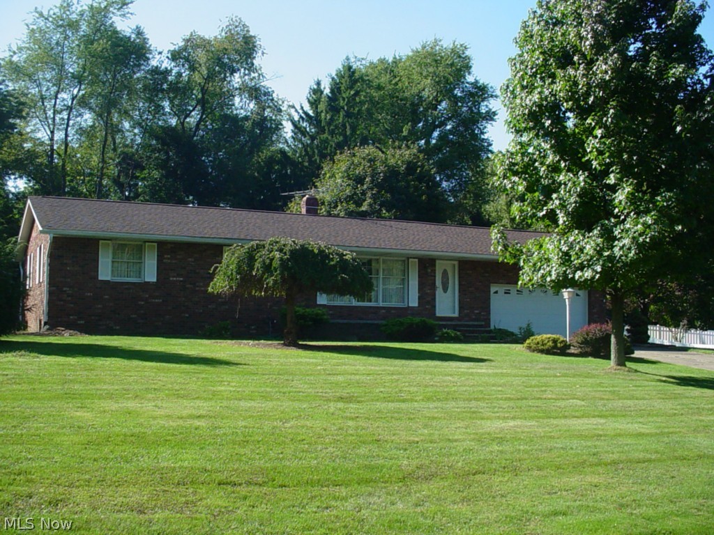 All brick ranch on over a half acre of privacy. Two full baths on main floor. Family room off dinette leads to a private patio with built-in gas grill. Many updates including furnace and ca, exterior doors and roof, glass block, windows and kitchen flooring. Appliances in kitchen stay. Rec room with fireplace, bar, pool table and game or media space adds an extra 602 square feet in the lower level.