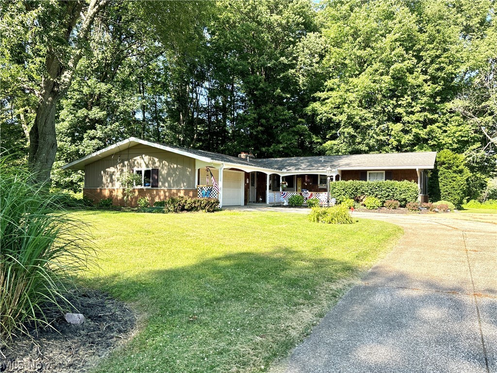 Welcome to 6424 Walrath Circle in the heart of North Kingsville. This spacious ranch home offers the comfort of one-floor living on a cul de sac street. You are welcomed into an entry that opens to an oversized living room with fireplace. The kitchen is open to the dining room with main floor laundry around the corner. The primary bedroom is large with an attached full bathroom. Two additional bedrooms and second full bathroom complete the main floor. There is an attached two-car garage that leads to the partially finished basement.  The basement features a large open living space and two rooms that were previously used as a 4th and 5th bedroom and a half bathroom. There is also a large unfinished room with built in shelving for storage. The backyard features a wood deck for relaxing and the wooded views offer extra privacy. In the Buckeye School District and under 2 miles from Lake Erie, this property is nestled in a community with access to natural amenities, covered bridges, and local wineries. Schedule your private showing today!