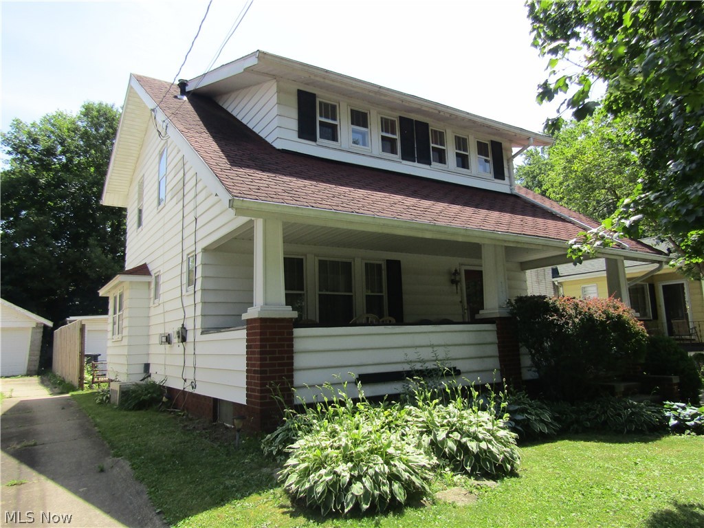 This home is full of beautiful details.  Gorgeous built-ins, nature stone basement flooring, newer furnace, newer hot water tank, central air and a four car garage with extra storage.  Gas fireplace, breakfast nook, laundry shoot, spacious front porch, and beautiful original wood flooring throughout the whole house are all a part of the notable character this house holds.  Many more unmentioned gems throughout, this one won't last long, schedule your showing today.