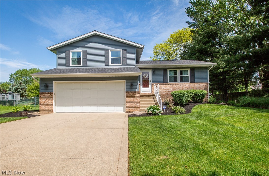Picture perfect describes this lovely 4 level split in Diamond Estates! It features a sought after open floor plan that is both inviting & efficient. The living room, dining room, & kitchen are spacious & updated with vaulted ceiling, farrmhouse sink, granite kitchen counters (2019) & island with breakfast bar (2016). Newer sliding doors (2016) with built-in blinds in the dining area lead to two tiered deck. The lower level family room also features newer sliding doors to ground level deck, fire pit, & big backyard. The remodeled main bath (2020) is absolutely beautiful with granite counters, tile flooring & linen closet with sliding barn door. Another full bath in the lower level was recently updated with granite counters & new light fixtures. Roof, windows, & vinyl siding were replaced in 2018, hot water tank in 2017, furnace & CAC in 2013. As you can see, this home has been meticulously cared for inside and out leaving nothing for you to do but move in and enjoy! Call to view soon!