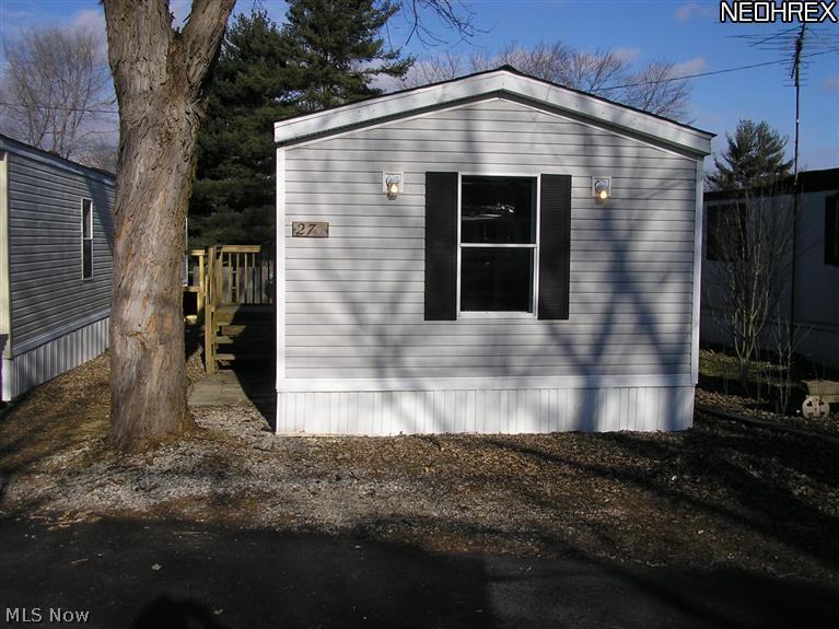 3 bedrooms, 2 baths. Home has had extensive updates. Roof 2013. New kitchen cabinets, counter top, floor, lights. Bedrooms, new carpet, lights, freshly painted. Area for laundry room. Lot rent is $235/month, includes water, sewer,trash pick up. $50 non-refundable application fee. Buyer must be approved by park manager. Seller is offering short term land contract. Free lot rent through September for any approved contract and application. Call for terms and conditions.