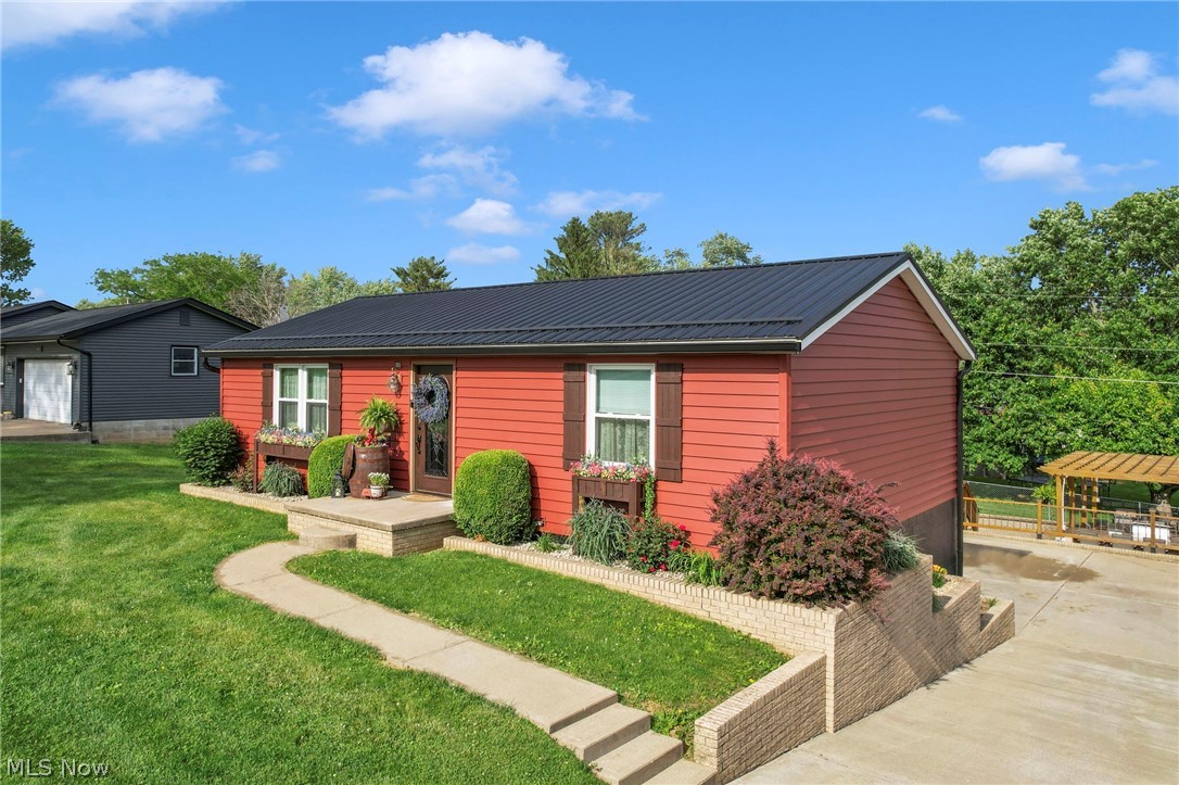 If you’re looking for the perfect place to call home, look no further. This beautiful property offers three bedrooms, two and a half bathrooms, and a versatile flex space that could serve as an office, playroom, or even a fourth bedroom. There is plenty of space throughout the home for comfortable everyday living and entertaining alike.

The home features first floor laundry along with a fully finished basement complete with a kitchenette and built in entertainment center, creating the perfect additional living space. There are a total of three garage spaces, including a two car attached garage and an additional detached garage at the back of the property.

Outside, you will find a stunning outdoor setup featuring a koi pond, an incredible outdoor kitchen, and a finished patio with pergola that creates the perfect place to relax and spend your time. The siding has been newly updated and comes with a transferable warranty, along with the recently updated roof, offering buyers added peace of mind. Beautiful butcher block countertops to be added in the kitchen, as well as a new sink. Kitchen appliances can stay.

This is a property you truly do not want to miss.