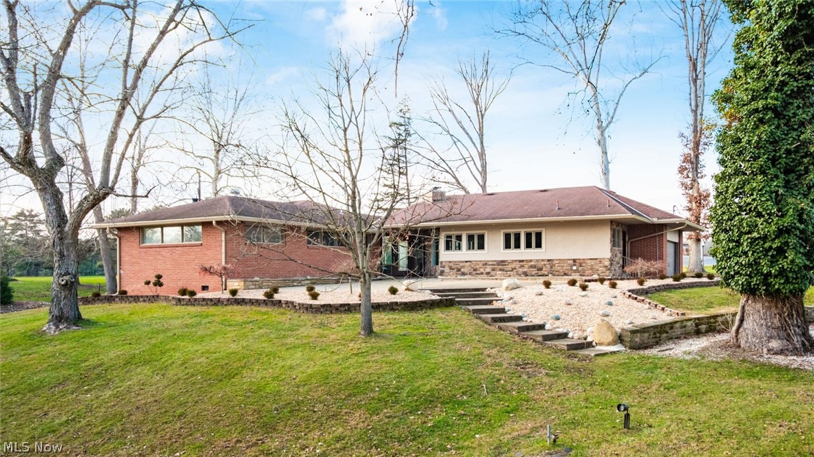 This exceptional ranch home offers the rare combination of single-level living and upscale comfort in one of the area's most desirable neighborhoods. The back side of this home is overlooking the Zanesville Country Club and Golf Course. Set on a beautifully landscaped lot, the house welcomes you with timeless curb appeal, mature trees, and a sense of privacy that enhances everyday comfort. At the front of the home there is an expansive patio that is perfect for outdoor entertaining. The open-concept layout is designed for effortless flow between living, dining, and entertaining spaces. The large entryway foyer is filled with natural lighting and opens to a spacious living area with a crystal chandelier that is timeless, many windows and a gas fireplace. There are oversized windows all through this home. There is a flexible living area with a gas fireplace and French doors that is being utilized as an office and leads to a patio area. The Gourmet kitchen offers stainless steel appliances that includes a side by side refrigerator, double wall ovens, dishwasher, stove top and built in microwave oven. The eat in kitchen has Quartz counters with a stone backsplash, recess lighting and tile flooring. The laundry room has extra cabinets for storage and is located near the kitchen and the 2 car garage. The primary suite is very spacious and offers a spa-inspired bath that includes a walk in tile shower and a double vanity along with 2 closets. There is a wonderful all season room that is adjacent to the primary suite that is lined with multiple sliding glass windows.The additional 2 guestrooms are large and feature carpet flooring and ceiling fans. The guest bathroom has a double vanity along with a tub/shower combination. In the basement you have loads of storage, a half bathroom and a family room. The wood flooring in the house is Bamboo. There is a whole house generator. The basement beer tap is excluded.