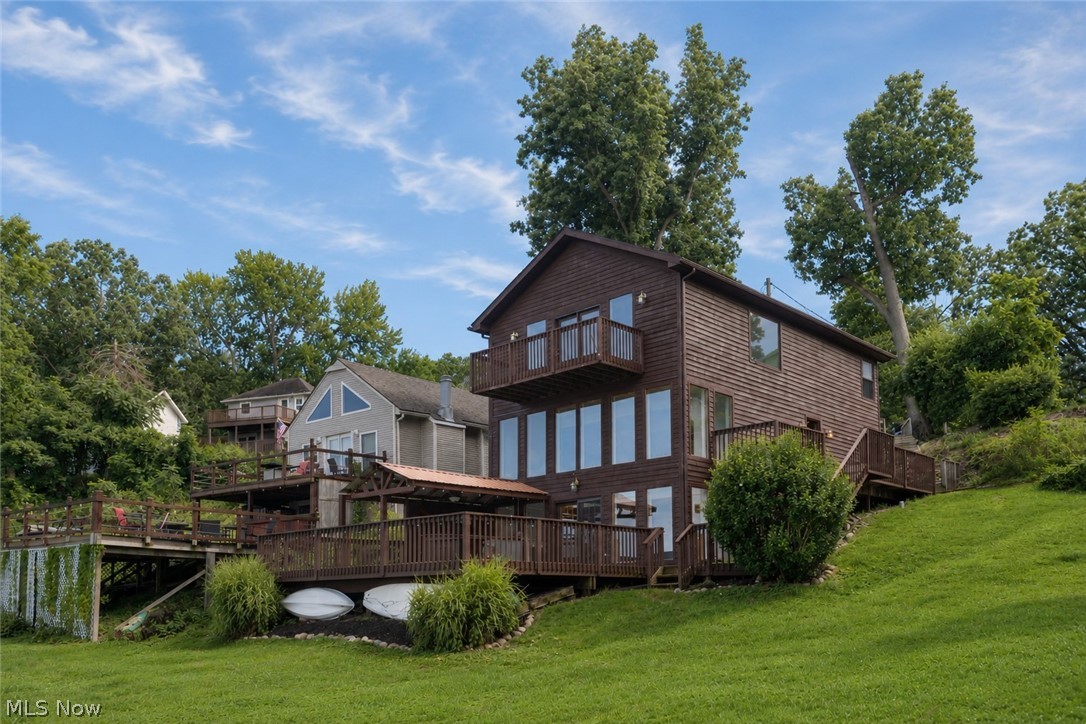 Stunning Lakefront Retreat – 3 Bedrooms, 1.5 Bathrooms. Welcome to your dream home nestled right on Long Lake, the most beautiful lake in the area! This charming 3-bedroom, 1.5-bathroom house offers incredible views and direct access to the water as the backyard goes right to the personal dock. As you step inside, you’ll be captivated by the expansive tall windows that invite natural light and showcase picturesque lake views from the kitchen, living room, and master bedroom. The spacious kitchen features elegant granite countertops and sliding glass doors that lead to a large deck, complete with a bar—ideal for entertaining or enjoying serene sunsets over the water. The open-concept living room, adorned with ceiling fans, provides a cozy atmosphere for family gatherings. The master bedroom is a true sanctuary, boasting a private balcony that overlooks the lake, along with a generous walk-in closet for all your storage needs. Step outside to your private backyard oasis, where you can unwind by the water or take advantage of the dock, perfect for launching boats and kayaks. The lake is stocked with a variety of fish, including bass, bluegill, sunfish, carp, gar, and catfish, ensuring endless recreational opportunities right at your doorstep. Roof, replaced in August 2019, providing peace of mind for years to come. This home is part of a lovely cluster of lakes, offering an ideal blend of tranquility and community. Less than a mile from Turkey foot golf course, the other lake chains and and plenty of local restaurants! Don’t miss your chance to own this slice of paradise—schedule a showing today!