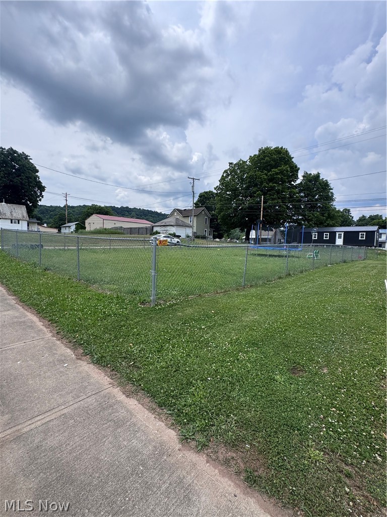 Build your dream home on this level 50' x 80' lot conveniently located on Broadway in Stockport. This ready-to-build property features existing city water and sewer taps, saving you time and expense when planning your new home. The lot is fully enclosed with a chain-link fence and offers easy access to local amenities, schools, and nearby recreation. Whether you're looking for a site-built home, investment property, or future homesite, this property is ready for your vision. Don't miss this opportunity to own a build-ready lot in a convenient location!