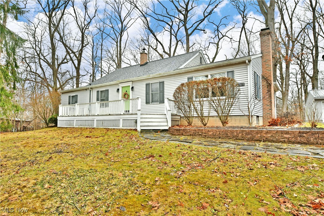 Imagine having scenic, personal getaway views every day from the comfort of your kitchen, family room or as you dine? This remarkable Corland residence places you high above sloping hillsides that overlook a winding waterway; a view that is best experienced in person for the amount of depth and natural beauty. Continue to expect the unexpected while you explore the tastefully updated ranch, brimming with naturally lit rooms and soft colorways that set the mood. The residence tucks off the road, veiled by trees as the driveway finds an oversized two-car detached garage and a bonus storage shed. Inside the foyer branches into an elegant dining room before the hall like living room wows with its tall ceilings and matching stone mantle with inset fireplace. Tiled flooring marks the nearby family/sunroom where a casual, rear entrance is found for everyday use. Enjoy the expansive kitchen complete with eat-in dining and a large island that oversees the tiled backsplash and stone-look countertops. Down the main hall, a trio of inviting bedrooms are joined by a handsome full bath and its array of cabinetry. The master suite completes the package with its own full private bath. Call today!