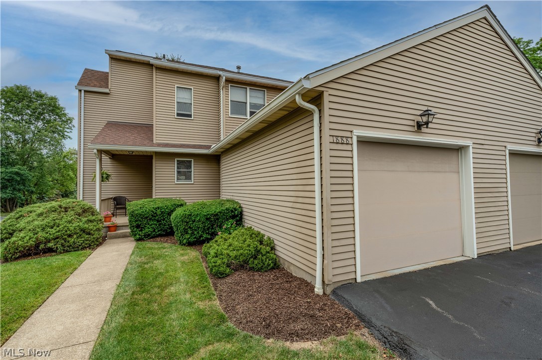 Welcome to 1888 Lillian Rd! This lovely, well-maintained condo is an END unit, and offers a large foyer entry, two bedrooms, 2 full baths, a large living room, a formal dining room, a loft, and a fully applianced kitchen. The master bedroom is very large and will accommodate king sized furniture as well as offering room for a sitting area. The 2nd bedroom on the 2nd floor would make a perfect office or guest bedroom. The large bath on the 2nd floor accomodates both bedrooms.  The lower level is finished with a large family room, and there is a laundry area (washer and dryer conveys), and an additional space for storage. In June 2022 the condo was freshly painted and new carpet installed. The whole condo is fresh and neutral in decor! The sump pump and H20 were also recently replaced, as well as the kitchen refrigerator. From the formal dining area, there is a slider that leads to a private patio. A wall separates the patio area from the neighbor next door for added privacy. The associa
