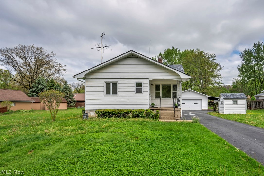 Well-maintained and full of potential, this 3 bedroom, 1 full bath home offers the extra space buyers are looking for both inside and out. Situated on a RARE .416-acre lot, the property features an oversized garage with workshop space, attached carport, a play house and plenty of room to enjoy the outdoors. Inside, the home offers a functional layout that can be enjoyed as-is or updated over time to match your style. The spacious backyard and extra lot provides endless possibilities for entertaining, gardening, play space, or creating your own private retreat. Additional features include a spacious basement with laundry area, abundant storage potential, and a chest freezer. Conveniently located just a block from Morgandale Park and offering quick access to shopping, dining, and major interstate routes, this home provides everyday convenience.