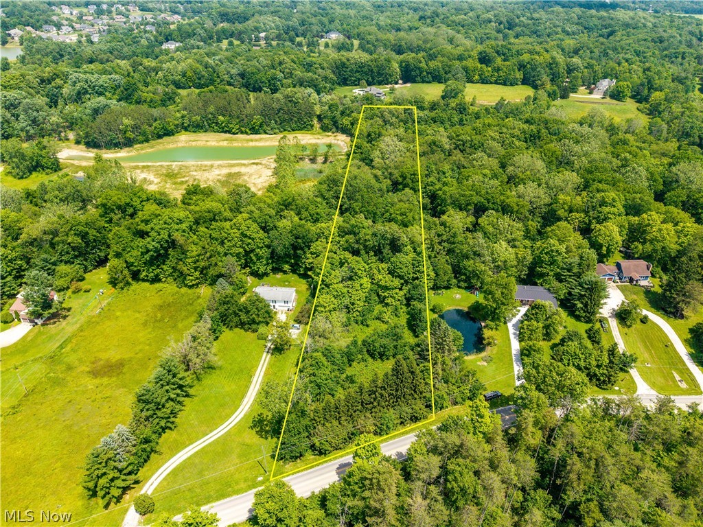 Looking to build your dream home in the highly desirable Montville Township area pf Medina, OH? Look no further! Discover the perfect blend of privacy, nature, and possibility on this stunning 3-acre wooded property, featuring the Rocky River flowing peacefully through the landscape. Towering trees and sweeping views create a serene backdrop for your future home, while the natural topography offers excellent potential for a walk-out basement design. Whether you envision a quiet retreat or a custom dream home built to your exact specifications, this property provides the ideal canvas. Enjoy the tranquility of nature with the convenience of nearby amenities—an exceptional opportunity to own a truly scenic and unique piece of land. Conveniently located within minutes of Medina High School, our beloved Downtown Square, the Medina branch of the Cleveland Clinic and in close proximity to State Routes 3,42, 18, 57 and I-71, this 3 acre wooded lot is the ideal spot for your forever home! Call your favorite Realtor to schedule your private showing today before its too late!