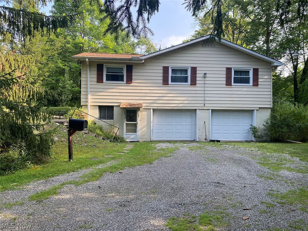 Fixer Upper 3-Bedroom Raised Ranch Home On 5 Acres - Ravenna, OH - Edinburg Twp. - Southeast Schools - Online & On-Site Bidding Available - ABSOLUTE AUCTION, all sells to the highest bidder. ONLINE BIDDING BEGINS FRIDAY – AUGUST 27, 2021 – 12:00 PM and AUCTION LIVE ON-SITE BIDDING WILL BEGIN MONDAY - AUGUST 30, 2021 - 5:30 PM SHARP. Location, location! This raised ranch home has unlimited potential. The home sits on 5 acres of wooded land. Features include 3 bedrooms, 2 bathrooms, galley kitchen, dining area, living room with fireplace, covered back deck, full walkout basement with bar and fireplace, oversized 2-car garage, breaker electric, well, septic, brick, and aluminum siding. Additional features include a barn and storage shed. Taxes are $713.44 per half-year. Square footage is 1,324 and the home was built in 1964. Home is ready for your priming and sprucing up. TERMS ON REAL ESTATE: 10% down auction day, balance due at closing. A 10% buyer’s premium will be added to the highest