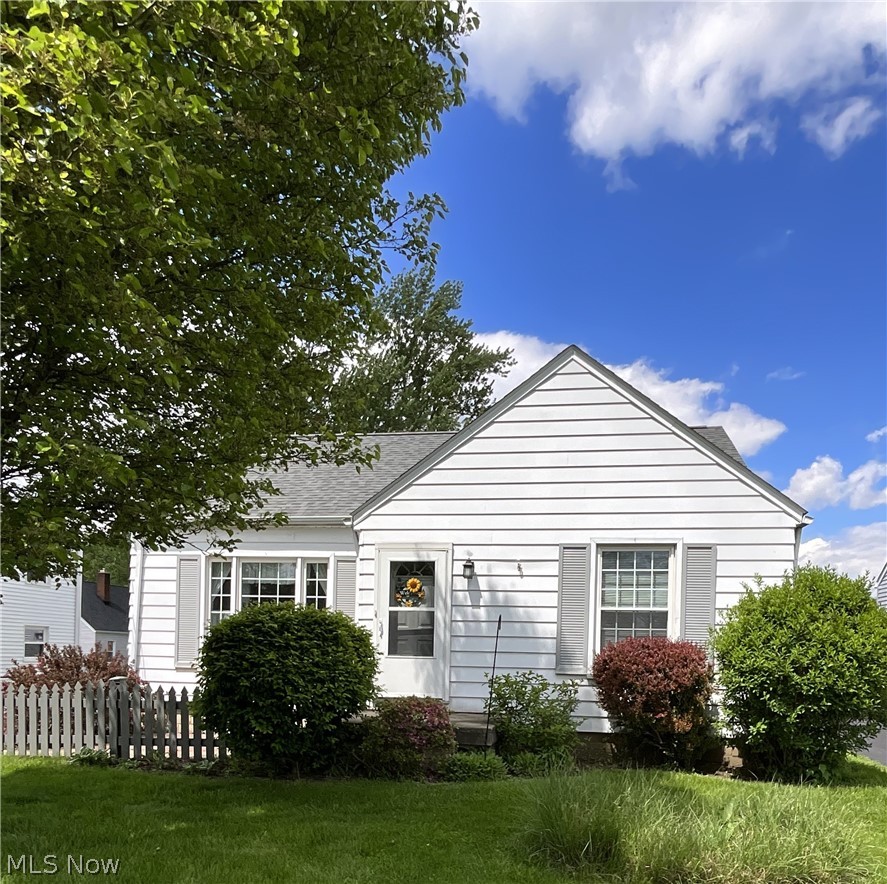 Charming Cape Cod home featuring 3 bedrooms and 1.5 baths. The living room offers a cozy fireplace, while the dining room includes a built-in corner cabinet for added character. Ans the family room provides extra living space. The main floor showcases original hardwood floors, and kitchen appliances are included. Roof- approx. 2022. Replacement windows and a seller providing a one year home warranty add comfort and efficiency. Selling as-is.