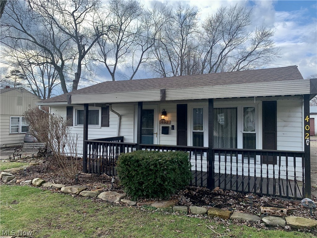 Easy and comfortable living space that is more spacious than it appears. Highlights include a living room with newer carpeting, dining room with french doors leading to the patio, kitchen with laminate flooring, new carpet in master bedroom, and main-level laundry area.  Multiple updates include newer windows, hot water tank, roof, furnace, central air, and sewer line from house to street in September of 2022. Ring doorbell and wood burner furnace in garage included with sale.