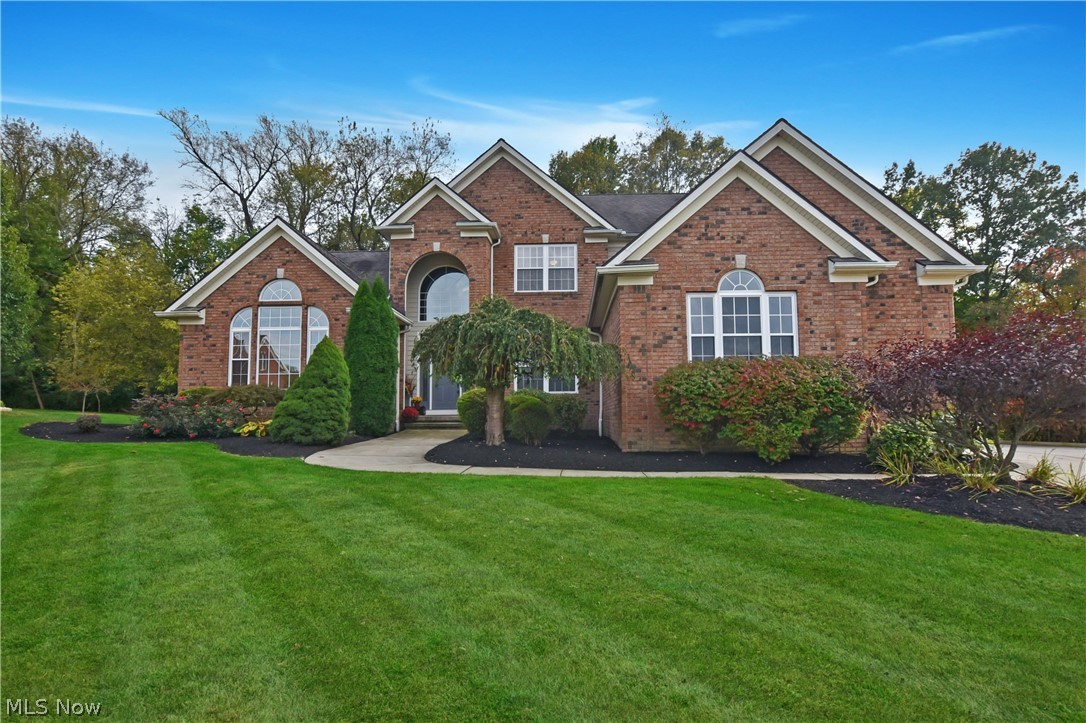 Wow just gorgeous!!! Luxurious custom built brick front Cape Cod/Colonial. Open floor plan with extensive quality amenities! A true pride of ownership! Shows like new. 2-story foyer with custom Finelli wrought iron spindles, wood floor and split staircase. Elegant formal dining room w/newer wood floors, crown molding and butlers pantry.   Gorgeous office, newer wood floors, custom windows open to master suite, 2-story great room with a wall of custom windows and built in fireplace. Newer wood floors in this stunning kitchen with custom cabinets, granite countertops, stainless appliances, large island pantry and a door to a large deck. Spectacular Luxury first floor master suite with cathedral ceiling, sitting room with french doors, fireplace and a door to the deck. Hallway to the  walk in closets, glamour bath with double vanity and newer floors.  First floor laundry room with built-in cabinets. Second-floor has 3 bedrooms, 2 Full baths, one a Jack & Jill and one with a private ensuit