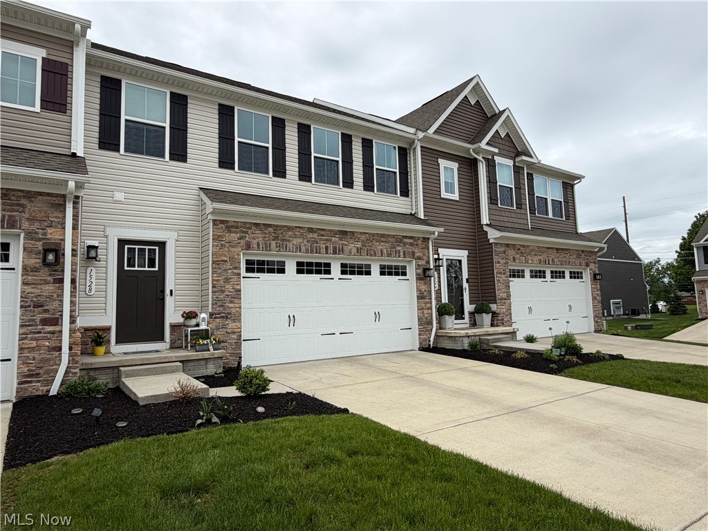 Welcome to this beautiful, move-in-ready townhouse located in the desirable Cedar Crest community, just minutes from shopping, restaurants, and the Summit Bike & Hike Trail. As you enter, 9-foot ceilings and luxury vinyl flooring greet you, flowing throughout the entryway. A half bath is conveniently located on the main level which leads into the open-concept living area. The open living room, kitchen and eat-in kitchen are an entertainer's dream. The kitchen includes upgraded 42 inch cabinets, a huge island with seating and newer appliances. Upstairs, the owner’s suite offers two walk-in closets and a private bath with a double vanity and a spacious walk-in shower. The second floor also includes a conveniently located laundry room, a cozy loft library space with electric and cable hookups, two additional bedrooms, and a full bathroom. The basement is ready to be finished, offering endless possibilities for additional living space with high ceilings and a storage area. Completing this home is a large two-car garage equipped with a drywall finish and a dedicated circuit for EV charging. The HOA fee covers all exterior maintenance, landscaping and snow removal which means there is nothing to do but move in and enjoy! Please let us know if you would like to schedule a tour today!