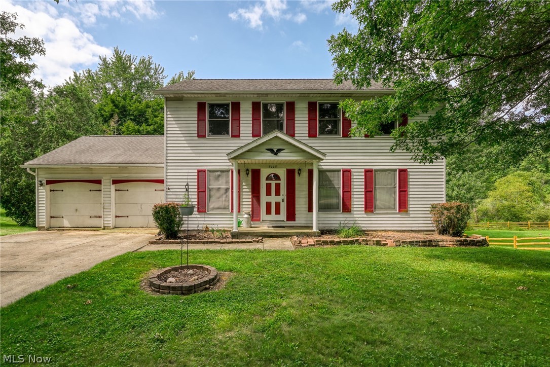This spacious 4 bedroom 2.5 bath colonial is ready for your personal touch.  This home is nestled on a private  .40 acre lot.  Bordered by trees in the back property line and side.  The spacious formal areas are in the front of the home and the half bath, eat-in kitchen and family room are in the back, with access to the back deck.  The master suite is spacious, with walk-in closet and full bath.  3 spacious bedrooms and a full bath complete the second floor.  The walk-out basement has a finished rec room and utility area, with a daylight window.  The 2 car garage provides extra work space and a man door exit. The private backyard has many possibilities.  The location, puts you close to expressways, universities, shopping, hospitals and entertainment.  This property has great potential.