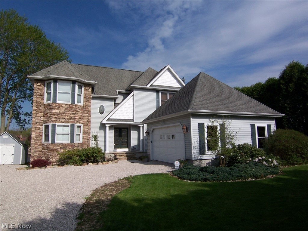 Gorgeous lakefront home with all the amenities! Gorgeous location on lake Roaming Shores and gorgeous views of lake Roaming Shores. 2 story foyer and living room, big private master bedroom with huge master bath and walk-in closet, formal dining room, large kitchen with a very quaint eating area overlooking the lake, and a big stone fireplace in living room with double doors out to deck overlooking lake Roaming Shores. Upstairs has 2 good sized bedrooms, a full bath and a nice room that could be either bedroom or office. Both bedrooms and office have tons of storage. The lower level is a full walkout lower level with nearly 10 foot ceilings and plenty of room for everyone. There's a big family room, a big bar, a pool table room, a sitting area great for table games, and another room for whatever you want! All overlook the lake.  There is a great covered outdoor seating/lounging area where you walkout from the lower level and then you can start to experience the Roaming Shores lakefront