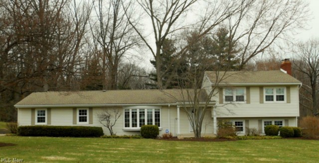 See this impeccable 2067 sq.ft. home on almost a 3/4 acre park like setting in N.E. Massillon. The first floor features a large living room with bow window and fireplace, dining room, updated kitchen and new half bath, all in neutral colors. Upper level has 3 bedrooms with wood floors under the carpet, full bath and loads of storage. The walk out lower level has a large family room with a wood burning fireplace, shower room and laundry room. The patio overlooks a large private back yard. The many updates in this home include  brand new a/c 2014, furnace, siding and roof 2004, replacement windows 2003. This home includes a home warranty. Priced to sell! 
Great curb appeal, call today to view this lovely home.