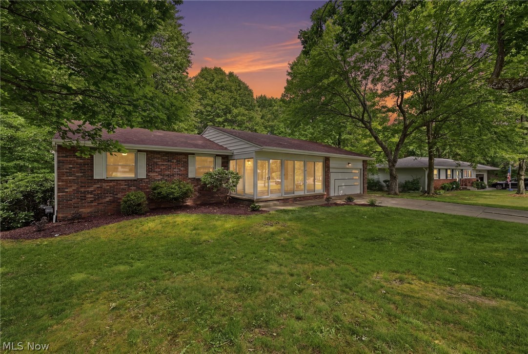 Move-in ready and beautifully remodeled! This stunning 4-bedroom, 2-bath ranch sits on a private, scenic wooded lot spanning 0.62 acres in desirable Norton Acres. Enjoy beautifully refinished hardwood floors throughout, along with all-new windows and appliances. The spacious layout features a living room, family room, finished basement, and a screened-in three-season room—perfect for relaxing and enjoying the natural surroundings. Additional updates include a newer hot water tank, updated A/C, a cozy wood-burning fireplace, and a newer deck overlooking the peaceful backyard. With its beautiful wooded setting and thoughtful updates throughout, this home offers the perfect blend of comfort and charm. Don't miss the opportunity to make this exceptional property yours!