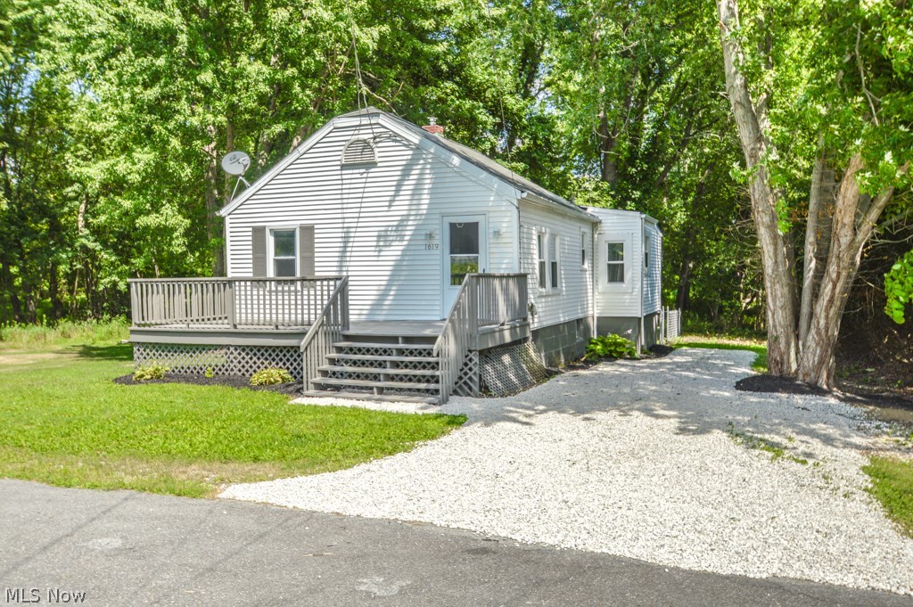Adorable ranch home on a large private/wooded lot in Copley Fairlawn School District. Country feel just outside the city, situated on a .77 acre wooded lot and private dead end street. Home feels much larger than it looks. Large kitchen with eat in area and built-in bench plenty of room for a large table for gatherings. 2 generous sized bedrooms and spacious living room. Enjoy your summer evenings on your 24?x10? deck.  Entire home has been freshly painted, new carpet, laminate wood floors in bathroom and kitchen, new windows and furnace in 2013.  Plenty of space to add a garage if desired. Small fenced in area. Great home for the first time home buyer or someone looking to down size, why pay rent when you could own for less. Seller may consider installing central air with an acceptable offer. All this plus a 1year home warranty for peace of mind.