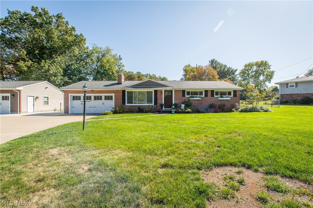 BEAUTIFULLY REMODELED RANCH IN JACKSON TOWNSHIP! This great home offers modern neutral decor and hardwood floors that flow throughout the entire house. You will feel right at home the moment you step into the bright living room with tons of natural light from the large picture window and a gorgeous stone fireplace with custom made built-in shelving. Prepare to be amazed by the fabulous kitchen featuring quartz countertops, white cabinetry, and subway tile backsplash. Head down the hallway to the master bedroom that offers great closet space with built-in storage and access to the full bathroom. In the full bathroom, you'll find slate flooring, a garden tub, a walk-in shower, and a beautiful double vanity. Bedroom 2 is currently being used as an office and bedroom 3 is being used as a sitting room. Make your way down to the lower level to see the finished rec room with vinyl plank flooring, a great place to relax or entertain guests. To access the patio in the backyard, you will go thro
