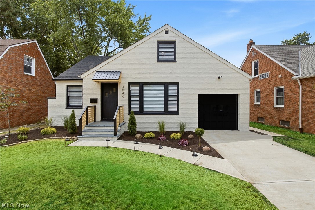 Welcome to 4046 Colony Road South, a completely renovated, all-brick home offering four bedrooms, three levels of finished living space, a designer kitchen, a private primary suite, a brand-new driveway, and an oversized fenced backyard! From the moment you arrive, the professionally landscaped front yard, modern farmhouse finishes, and attached one-car garage create incredible curb appeal. Inside, you’ll find a spacious living room, formal dining room, and a beautifully redesigned kitchen featuring high-end Samsung stainless steel appliances, quartz countertops, soft-close cabinetry, a chef-style sink, full-height backsplash, and center island with seating. Just off the dining room is a cozy family room and sunroom, perfect for relaxing, entertaining, or enjoying your morning coffee. The first floor includes two generously sized bedrooms and a completely renovated full bathroom with stylish tile, fixtures, and finishes. Upstairs, you’ll find another bedroom with a built-in office area and closet, along with an impressive primary suite featuring room for a king-size bed, a walk-in closet, and a beautifully updated private half bathroom. The partially finished basement offers additional living or entertaining space, a laundry area, another half bathroom, and plenty of storage. Outside, enjoy the patio, storage shed, and expansive fully fenced backyard with room for kids, pets, and gatherings. Thoughtfully renovated inside and out, this home is truly move-in ready! Agent is owner.