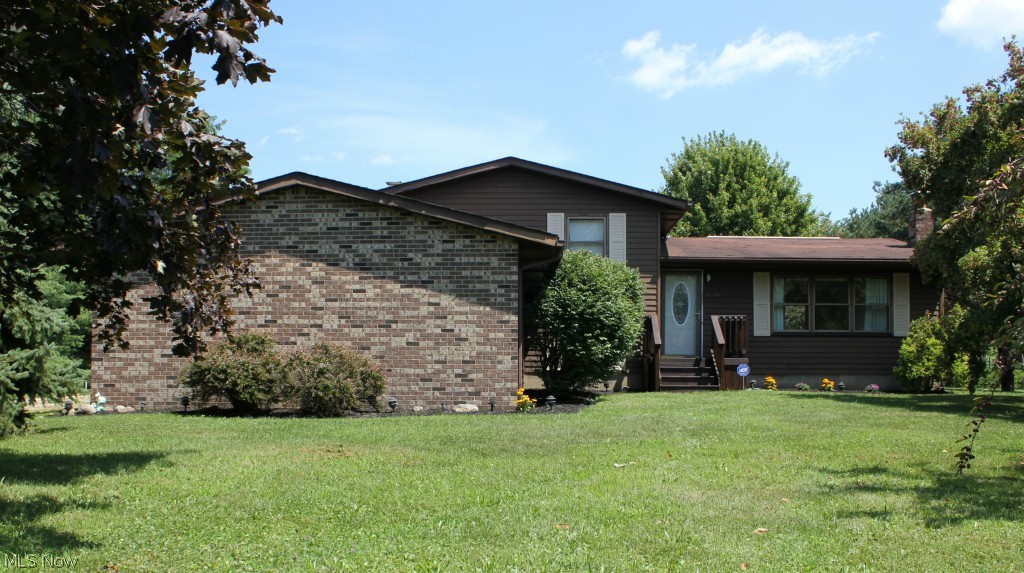 Welcome to Country living in this bright and spacious split level home located on a quiet street.   Meticulously maintained home has a large living room which flows into the eat in kitchen and dining room that has sliding doors out to backyard deck.   Family room includes brick full wall wood burning fireplace with barn wood mantel.   Office with updated full bath is also located on lower level.    Upstairs includes Master bedroom with 2 large closets,  2 additional bedrooms with tree views and a remodeled full bath.   

Mature trees surround the over 1.5 acre lot with pool and large updated back deck.   The 24X32 barn with 10' ceiling is large enough for all your storage and a perfect work shop.   Home also includes security system and a wood/coal burning supplemental heating system to save on winter heating bills.