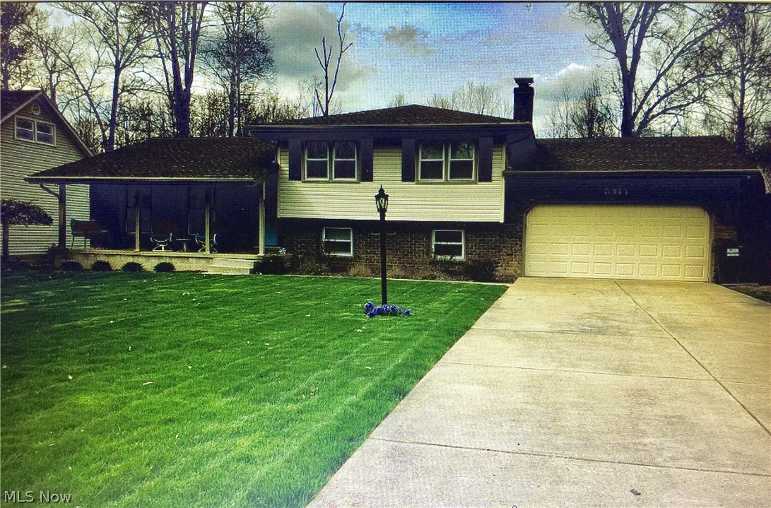 You will love this Austintown 4 bedroom, 2 bath split/level on a quiet street w/a backyard to die for. The backyard has a deck with an outdoor kitchen that includes outdoor granite countertops! Dad can grill to your hearts content for all of your birthday parties and family get togethers!   The landscaping has already been done and gives the home that fresh modern curb appeal! You will love the flow of the kitchen, dining room and family room that gives mom an open feeling instead of feeling secluded! The owners have done numerous updates to this fine home, with too many to list, that have to be seen to be appreciated!  The three bedrooms are upstairs in the upper level and the master is oversized giving you enough space for a king size bed & large furniture. The lower level has been finished and includes a fourth bedroom and an additional living space for that teenager that wants his own gaming or weightlifting room!  Better book your appointment today before this beauty is gone!