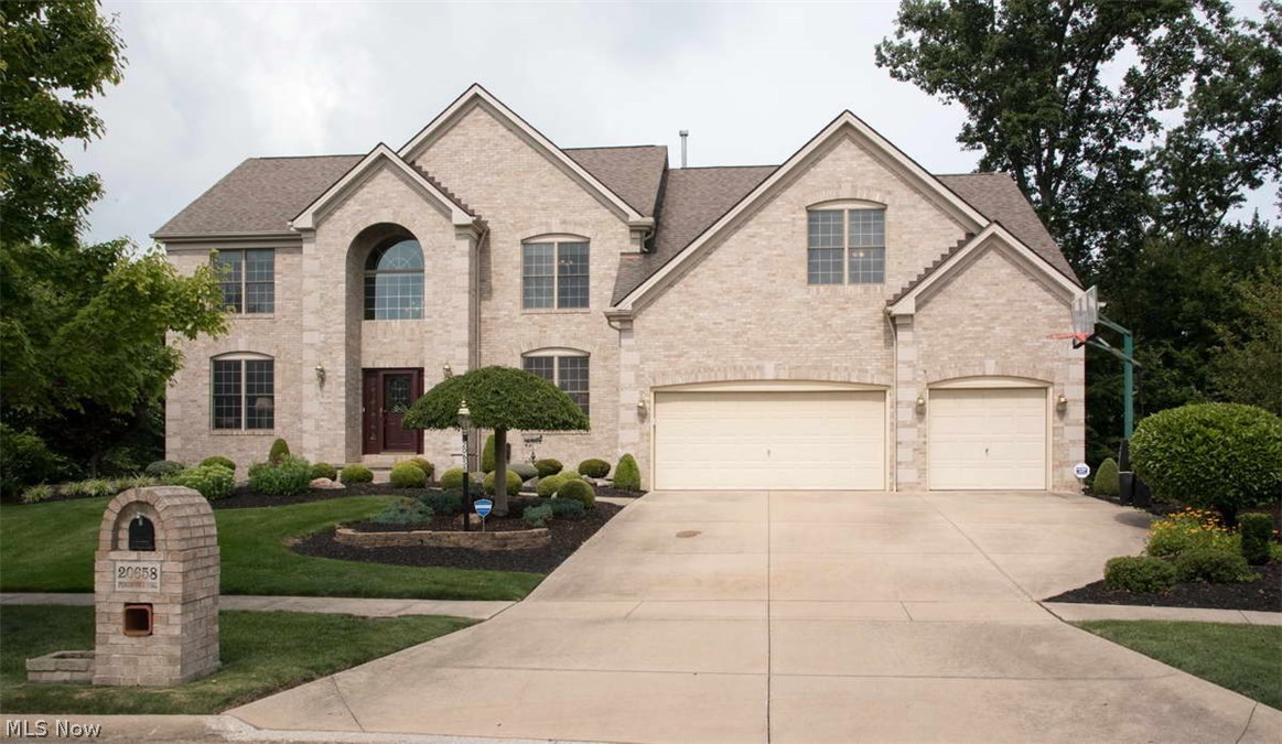 Pristine Parkview custom "Bentley" showplace dream home on private wooded greenbelt lot in Waterford Crossing. Major 2008 inside upgrades. Brazilian wood floors flow through 2 story foyer, 2 story great room, formal dining room, living room, and kitchen. The 9 rooms+ finished lower+ exercise room provide over 5,500 sq ft of luxury living space, 4 BR, 3 ½ Bath, huge 2 story Great Room with 12 windows, granite and slate floor- to-ceiling fireplace, 1st floor den/library/study has coffered ceiling and full wall of built-in book casing. Voluminous remodeled eat-in Kitchen has newer cabinetry accented with glass display doors, granite counter tops, slate backsplash, stainless steel appliances. An enormous vaulted Master Suite has a romantic sitting area with a 2nd fireplace, 2 huge walk-in closets, remodeled master bath with skylight, oversize tile shower and steeping tub. Tall finished Lower Level has a large recreation room, wet bar with 2nd refrigerator, wine cooler, additional exercise room, 3rd full bath, newer hi-efficiency gas furnace/ AC. All custom window treatments, security system, multi-room sound system, professionally landscaped manicured grounds with sprinkler system and large deck overlook private yard that abuts wooded neighborhood preserve. Walk to pool, playground, tennis, lake, elementary school within the Waterford Crossing subdivision. Call today to see this most desirable luxury home.