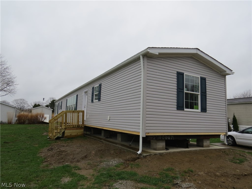 New construction single-wide manufactured home offering 3 bedrooms and 2 full bathrooms. 1140 sqft. Open-concept layout enhanced by added windows for abundant natural light. The spacious primary suite features carpet, ceiling fan, walk-in closet, and a private bath with walk-in shower and extra window. Bedrooms #2 and #3 are carpeted as well.  LVT flooring in Kitchen, Dining Area, both bathrooms, hallway and laundry area. Functional hallway desk area is ideal for home office or study space. Kitchen includes stainless steel appliances—gas range, refrigerator, microwave, and dishwasher. Home comes complete with drape package and 2” mini blinds throughout. Forced air furnace and central air included.