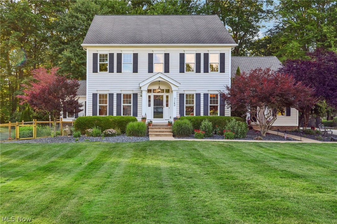 Welcome to this exceptional custom-built home nestled on over an acre of beautifully landscaped property in the highly desirable Poland School District. Offering 4 spacious bedrooms, 3 full baths, and 2 half baths, this impressive residence combines elegant design with everyday functionality. The open-concept floor plan features a stunning great room with a wood-burning fireplace, a beautifully appointed kitchen with high-end cabinetry, an oversized island, and concrete countertops, plus a private office with custom built-in bookshelves. The luxurious owner's suite boasts a spa-like bath and an expansive walk-in closet. The finished lower level adds approximately 1,300 square feet of additional living space, complete with a recreation room, family room, and a granite wet bar. Enjoy year-round relaxation in the bright sunroom overlooking the fenced backyard that backs directly to the scenic Poland Woods. Additional highlights include hardwood floors, a heated attached two-car garage, mudroom, built-in outdoor grill, and exceptional storage throughout. This is a rare opportunity to own a meticulously maintained home in one of Poland's most sought-after locations. Schedule your private showing today!