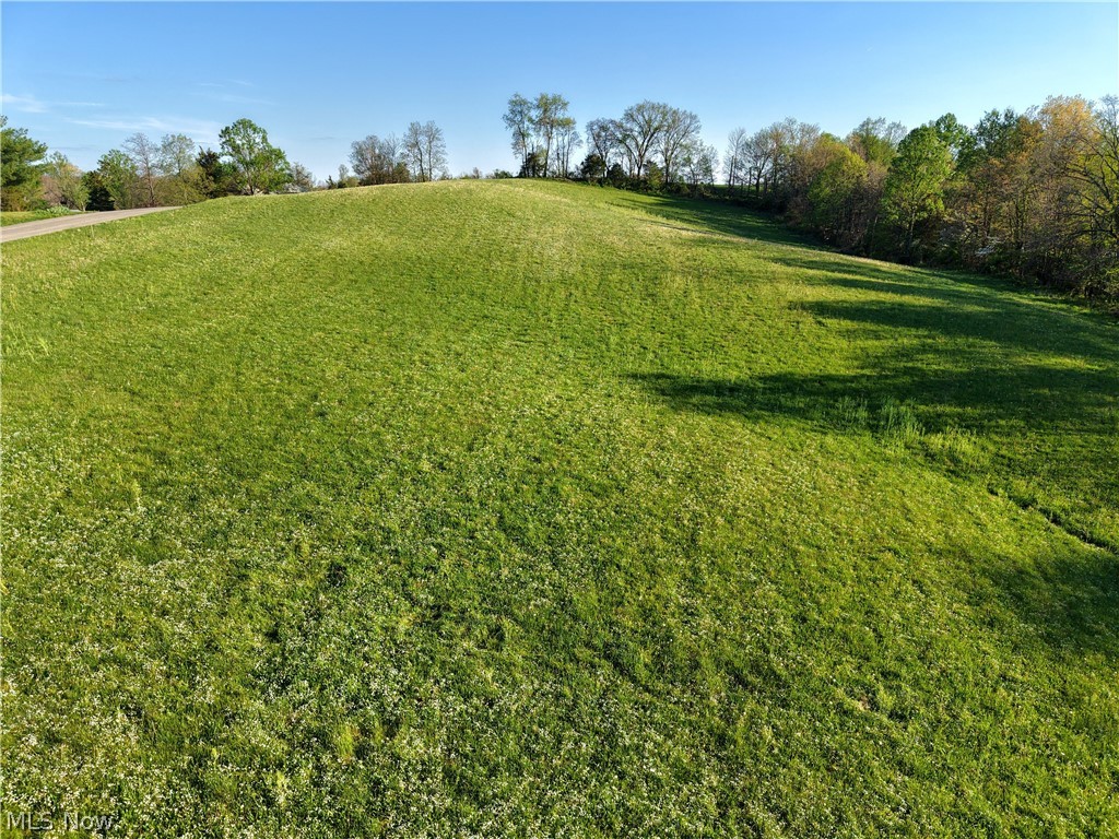 Discover the perfect place to build on this 4.641 acre tract located on paved Johnson Ridge Road in Morgan County, just minutes from the Washington County line. This beautiful property offers a fantastic homesite with the convenience of AEP electric and Tri-County Water Authority water availability. Enjoy the peaceful country setting with easy access from a paved road, making this an ideal location to build your dream home.