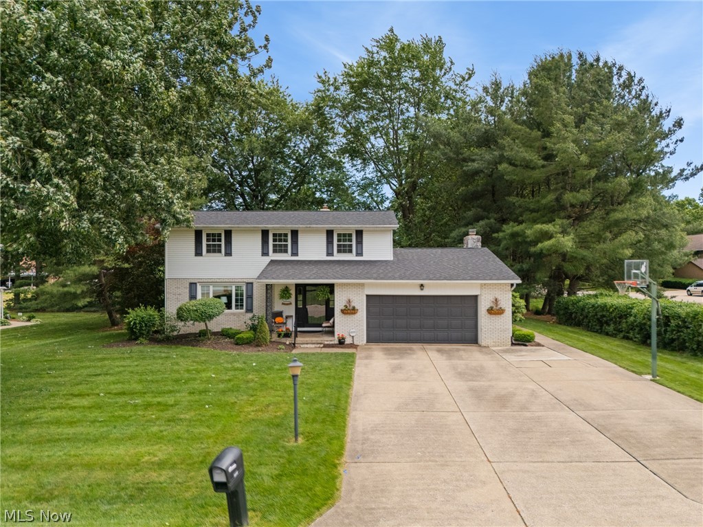 Welcome home to this beautifully maintained 4-bedroom, 3 full-bath home in the highly desirable Bob O' Link neighborhood, located within the sought-after North Canton School District! Thoughtfully updated and meticulously cared for, this home offers spacious living areas, modern finishes, and exceptional indoor-outdoor living. The inviting eat-in kitchen features refreshed white cabinetry, granite countertops, newer appliances, and luxury vinyl plank flooring, creating the perfect space for everyday meals and gatherings. New carpet throughout the majority of the home adds a fresh feel. On the main level, you'll also find both a welcoming living room and a cozy family room with a gas fireplace, along with the convenience of first-floor laundry—washer and dryer included. The showstopper is the oversized sunroom with stunning herringbone tile flooring and walls of sliding glass doors that flood the space with natural light before leading out to the deck overlooking the private backyard. An invisible pet fence is already installed, making it ideal for furry family members. Upstairs offers four generously sized bedrooms, including a spacious primary suite with a walk-in closet and beautifully updated ensuite bath featuring a walk-in shower. The updated hall bath includes a deep soaking tub for the remaining bedrooms to share. The finished lower level provides the perfect rec room for entertaining, movie nights, or a play area, while the unfinished storage space offers plenty of room for seasonal items and includes a convenient walk-up to the backyard. Additional improvements include basement waterproofing, a roof approximately 5 years old, a 2017 hot water tank, some replacement windows (2008), and replacement sliding glass doors in the sunroom approximately 6 years ago. With its flexible floor plan, tasteful updates, abundant storage, and prime location, this move-in-ready home is ready for its next chapter!
