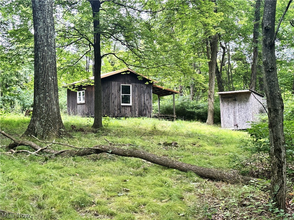 MINERAL RIGHTS INCLUDED with this 5.35-acre parcel of mostly wooded land with a small hunting cabin! A true hunters delight! Escape the city life and hang out in the country and enjoy the peace and quiet along with the natural beauty of this land! (Owners currently own 75% of the mineral rights and they are currently not under a lease.)