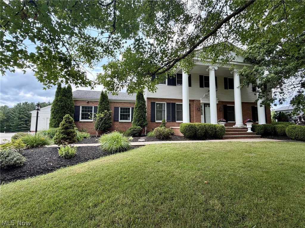 Classic Colonial Revival Home set on 1.75 Manicured Acres in Chardon Twp! Incredible living space with 4 Bedrooms, 3.5 Baths & finished walk-out basement. Foyer entry welcomes you into both the Formal Living & Dining Rooms. Large Family Room features brick wood burning fireplace flanked by custom built-in bookcases & cabinetry and slider to the bright and relaxing 3-Season Sunroom. Eat-in Kitchen with all appliances included. Upstairs, the spacious Master Bedroom includes a walk-in closet & private full bath. 3 additional bedrooms & full bath complete the second floor. The finished walk-out lower level includes large Rec Room complete with wet bar, full bath, laundry room & storage area. Built to last, this solid home features brick front with vinyl siding, pillars, concrete driveway, attached 2+car garage plus 30x28 detached garage with a lower-level for workshop & lawn equipment storage. Step outside to the expansive deck overlooking deep backyard & fenced dog run/kennel. Lovingly maintained by its original owner, this quality-built home is ready for its new owner to add your own updates and personal style. Ideally located just minutes from schools, Geauga parks, Chardon Square, shopping, restaurants and easy freeway access!
