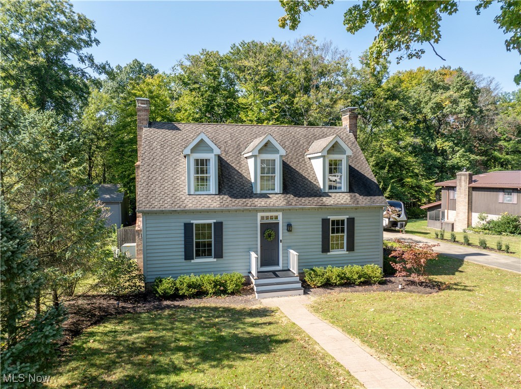 Welcome to 11006 Northwood in Bolivar, where historic charm blends seamlessly with modern luxury. Modeled after the Bracken House from colonial Williamsburg, this home captures the elegance of the past while offering today’s conveniences. The main floor features soft pine flooring with rod iron nails, flowing throughtout.The kitchen, remodeled in 2021, is a chef’s dream with Alpine cabinets, Cambria quartz countertops, subway tile backsplash, & island with a beverage center. A hidden coffee station, farmhouse sink, smart lighting controls, pull-out shelving add both charm and function. A paneled Beko dishwasher and dual-fuel range, complete the space.The adjacent family room boasts a coffered natural beam ceiling and a masonry fireplace with a cooking arm. There are three woodburning fireplaces, with gas hookups. A flex room on this level can serve as a first-floor primary bedroom or an office, featuring a walk-in storage closet and access to a full bath and laundry area.Upstairs, three bedrooms, each with newer carpeting and charming dormers. The primary bedroom offers double closets, while a large linen storage closet ensures plenty of storage space.In the basement, a rec room provides the perfect setting for movie nights. The additional bedroom has a walk-in closet and half bath, plumbed for a shower. A semi-unfinished space offers endless possibilities for a home gym, craft area, or workshop, complete with cabinets, sink and 2nd laundry hookup.Outside, the cedar and brick exterior is complemented by a covered porch connecting the home to a two-car garage with 30-amp electric. The half-acre lot features a brick paver patio and tree-lined privacy at the back.This home also boasts modern mechanicals, including wiring for generator,HVAC replaced in 2017 & Central air in 2018. Flek water softener system and an April Air humidifier. Every detail has been thoughtfully designed to provide an exceptional living experience. Subject to seller finding suitable housing.