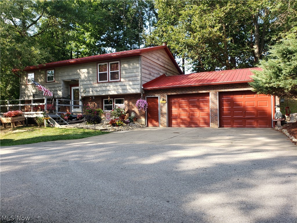 Want to feel like your out in the country, but close to town and all the amenities... Look no further!! This property is last house on end of Sleepy Hollow Dr. hidden away for your peaceful way of living. Many updates to this house including a brand new roof, windows, furnace and A/C. Spacious rooms & storage. Enjoy the oversized front and back decks for all your outdoor enjoyment. You may just get a sneak peak of the Shamrock Football team on a home game. Nice deck overlooking the stadium. There are 2 beds upstairs with a full bath, downstairs you have 2 possibly 3 bedrooms, laundry room with bathroom. Rec room for entertaining. Nice 2 car garage and also extra parking for your guests. Right beside football stadium. Close to Park, schools, grocery stores. Don't miss out on this wonderful property!! Call Today!!