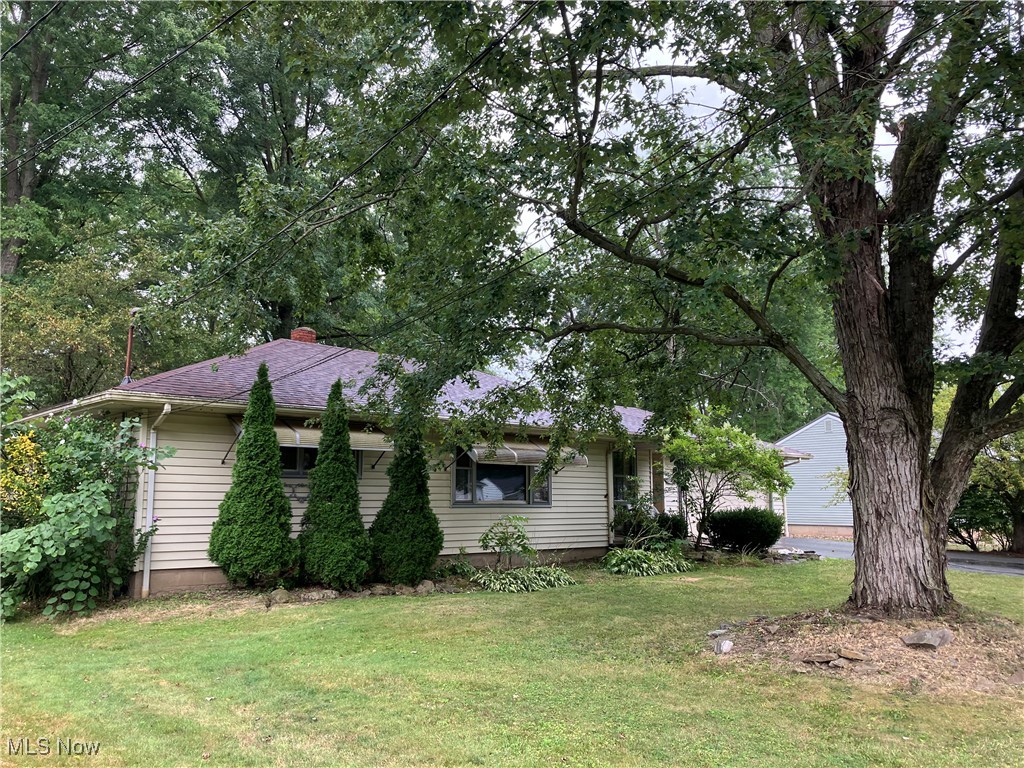 Opportunity is knocking with this nice three bedroom, one bath ranch-style home featuring a large living room for entertaining, spacious eat-in kitchen with appliances, stunning hardwood floors, year-round Florida room off the back, full basement and attached two-car garage. You'll spend plenty of time on the patio and in the private yard featuring a large outbuilding/workshop with electric and heat. Additional highlights include a brand new roof, central air and gas heat. This property offers immediate occupancy, making it move-in ready. Call for more details.