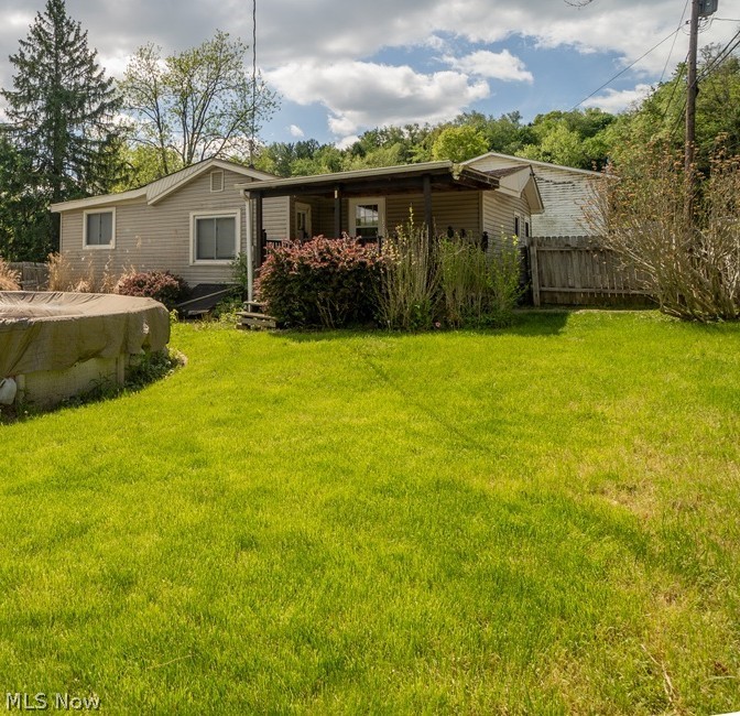 Take a look at this recently updated home on a quiet street. The spacious kitchen has hardwood flooring and Stainless Steel appliances. The large bathroom has been updated with hardwood flooring, a grey vanity, and has a 1st floor laundry room inside the bathroom making doing the laundry very easy. The living room is carpeted and has a serving window into the kitchen for convenience. The bedrooms are carpeted as well. The yard is fenced in for privacy. Come and make this your new home today!