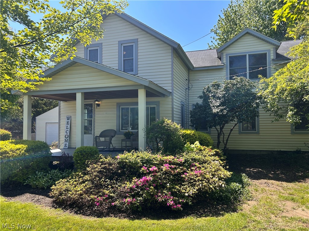This large 4 bedroom colonial has many updates. It offers plenty of space and comfort for your family. Featuring 2 full baths and a large 21 x 15 great room complete with a free standing wood burner, it's perfect for cozy gatherings. Enjoy the bright 15 x 13 four season room with an cathedral ceiling and sliding doors leading out to a spacious deck. Ideal for entertaining or relaxing outdoors. The entryway leads to the updated kitchen which boasts matching silver appliances that will dazzle your company while making meal preps.  A large garage with the rear pulled through provides ample parking and convenience. This home sits on semi private, large .76 of an acre lot. Spend your evenings on a beautiful open porch and take advantage of the plentiful storage throughout the property. You'll notice recent updates as you tour this home that has a warm, farm type feel. This home is move-in ready. Did I mention, Mentor Lagoons is right down the street!