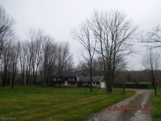 This home offers 4 bedrooms, 2 baths, lower level family room W/Woodburner Extra 12x12 computer or mud room. Kitchen W/Breakfast bar. Hardwood floors in dining & living rooms.Two tiered deck, 9 stall barn W/ electric & water. 4 Acres. Needs interior updating. Being sold as is.